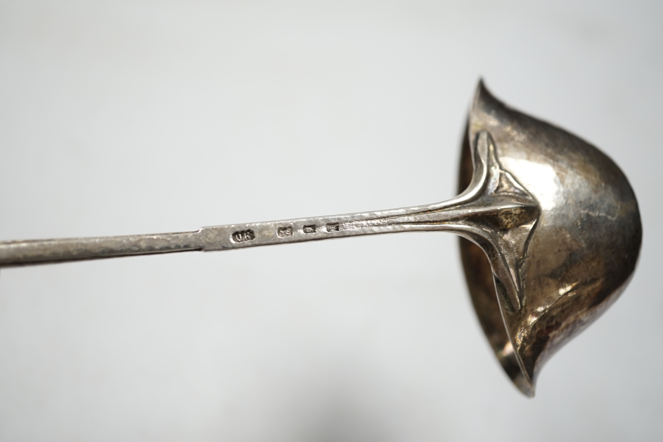 A George V Arts & Craft silver cream ladle by Omar Ramsden, London, 1934, 16.7cm, 49 grams.